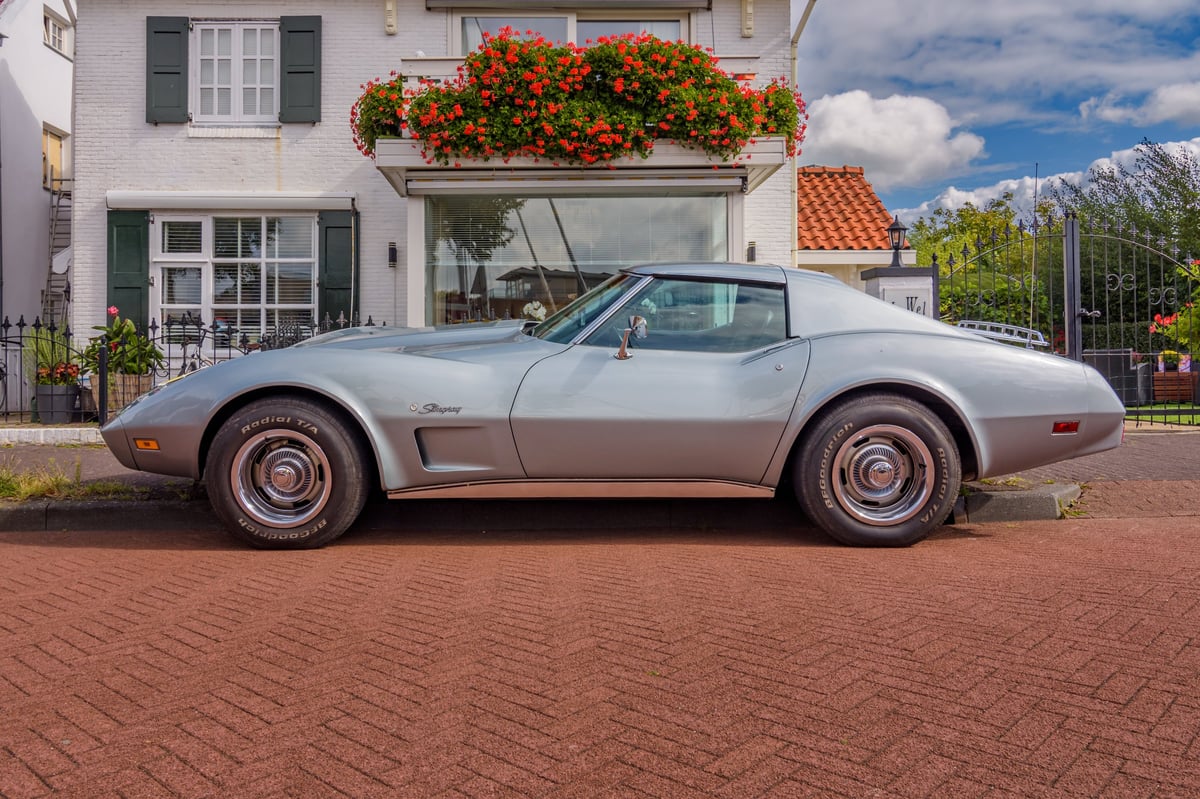 A classic, high-end Chevrolet Corvette Stingray with a bright, polished finish